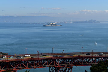 part of golden gate bridge with alcatraz in the background - 723826337