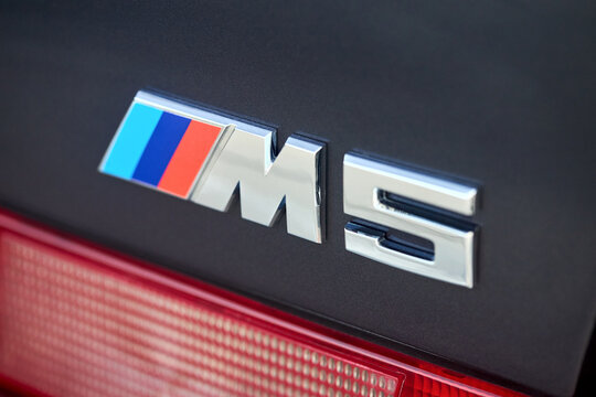 Berlin, Germany - August 20, 2022: Car Detail Shot of BMW E28 M5 1984-1988 M5 badge logo emblem selective focus closeup