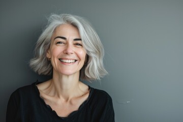 Beautiful gorgeous 50s mid age beautiful elderly senior model woman with grey hair laughing and smiling. Mature old lady close up portrait. Healthy face skin care beauty, skincare cosmetics, dental Ai