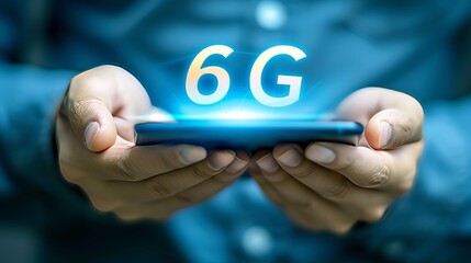 Shining holographic 6g text icon displayed interactively over a mobile phone held in hands