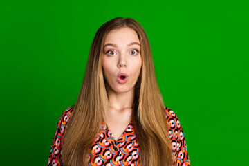 Portrait of speechless teen with long hairstyle wear print blouse astonished staring open mouth...