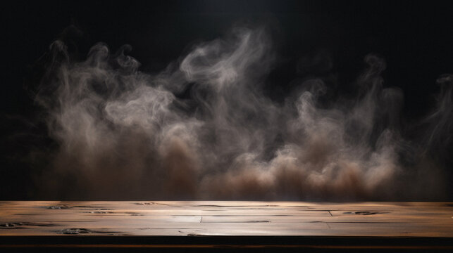 Wooden table with smoke on a black background. Copy space .
