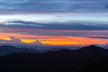 Incredible sunset at Doi Pui viewpoint, Chiang Mai, Thailand. Colorful sky over the mountains.