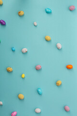 Easter cocnept colour eggs on blue surface