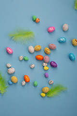 Easter cocnept background eggs  on blue surface top view