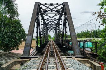 black steel bridge train across river