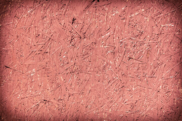 Chipboard board painted with red paint as an abstract background