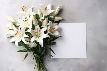 A bouquet of lilies on a background with a postcard.