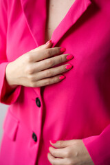 Pink nails festive manicure for Valentine's Day. Fuchsia suit. Image for the holiday, international...