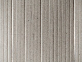 The brown paper background has many straight lines.