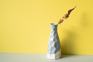 vase with yellow flower