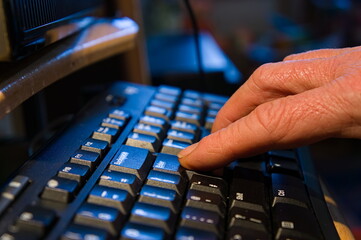 fingers typing on keyboard