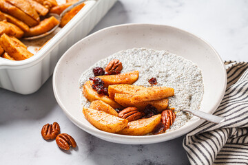 Chia pudding with caramelized apples, pecan and cranberries. Winter vegan breakfast recipe.