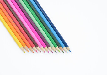 Obraz premium Seamless wooden coloured pencils placed in a row facing down isolated on light background
