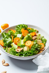 Kumquat salad with avocado and nuts.