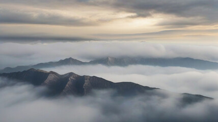 Fototapeta premium Mountain peaks covered in heavy fog 