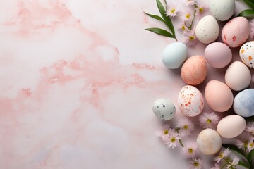 Pastel easter eggs with flowers on soft pink background, top view, empty space for text