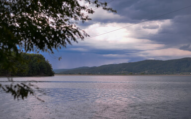 Strong summer storm. Water bubbles formed on the surface of the lake due to heavy rain