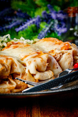 Stuffed pancake baked with cheese.