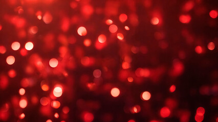 Red sparkling bokeh lights on blurry background. Festive abstract design, love concept. Defocused circle lights, falling shiny confetti