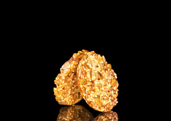 Two sweet Thaler cookies, macro, isolated on white background.