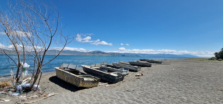 boats on the bank of lake Sevan in armenia rather old models