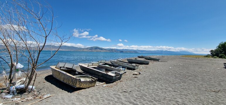 boats on the bank of lake Sevan in armenia rather old models