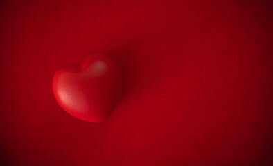Red heart on a red background