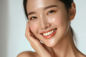 Closeup Beautiful smiling asian korean woman touch face with smooth healthy skin