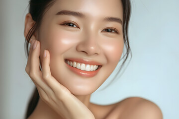 Closeup Beautiful smiling asian korean woman touch face with smooth healthy skin