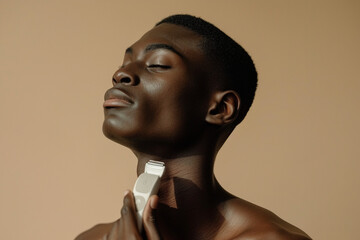 Obraz premium Black man shaving his beard, with silky smooth skin