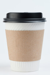 One clean paper cup with lid and sleeve