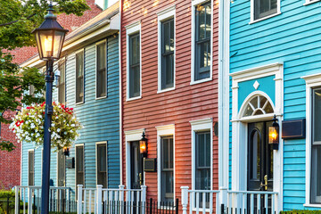 Detail of a row of the colorful Victorian clapboard houses in Charlottetown, capital of Prince...