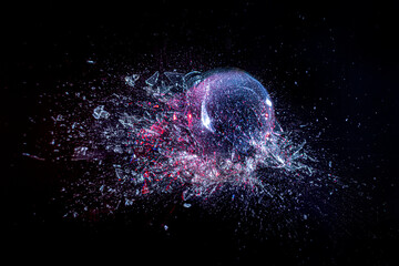 explosion of a glass ball on a black background.