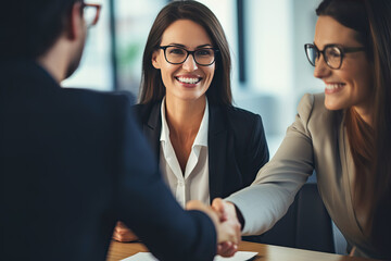 Happy mid aged business woman manager handshaking at office meeting. Smiling female hr hiring recruit at job interview, bank or insurance agent, lawyer making contract deal with client - obrazy, fototapety, plakaty