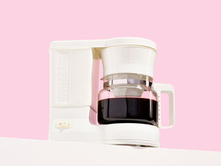 A coffee maker with freshly made coffee. Morning at home with delicious strong coffee.