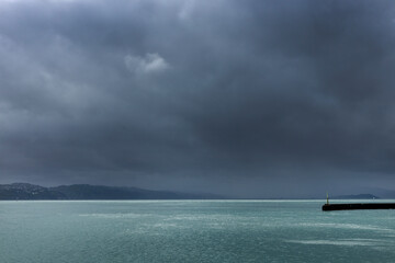 Rainshowers. Wellington New Zealand. Threatening skies. Queens Warf. Coast. Oriental Bay.