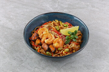 Wok with seafood studio shooting on a white background 2