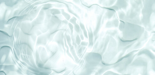 Obraz premium Abstract summer banner background transparent blue clear water surface with ripples. Water surface in sunlight, copy space, top view. 