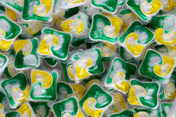 Dishwasher detergent capsules and or laundry soap background.