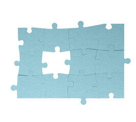 Fragment of folded jigsaw cardboard puzzle and pile uncombed puzzle elements against background, development of logical skills, puzzle solving