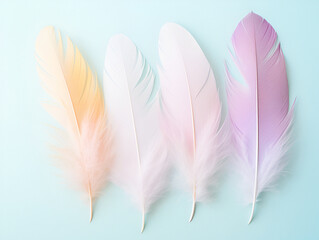 Obraz premium A soft-focus image of pastel-colored feathers, symbolizing Easter's gentleness, Easter, pastel background, Flat laid, top view, with copy space