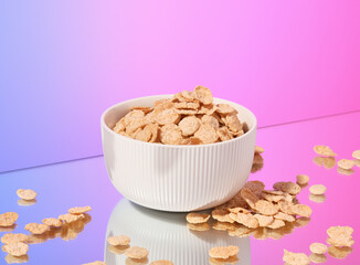 Dry cereal flakes in a white bowl. Healthy breakfast.