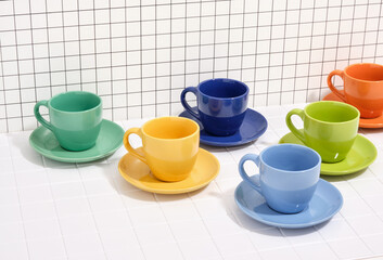 Ceramic crockery. Cups and plates, lunch or dinner. Modern colorful dinnerware.