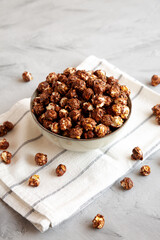 Homemade Chocolate Caramel Popcorn in a Bowl, side view.