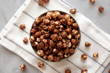 Homemade Chocolate Caramel Popcorn in a Bowl, top view. Flat lay, overhead, from above.