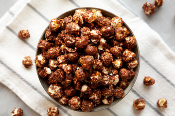 Homemade Chocolate Caramel Popcorn in a Bowl, top view. Flat lay, overhead, from above.