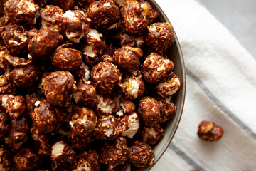 Homemade Chocolate Caramel Popcorn in a Bowl, top view. Flat lay, overhead, from above.