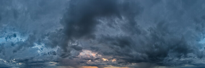 Russia. The South of Western Siberia. Gloomy sunset clouds in the evening summer sky over the fields of Altai.