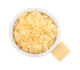 Grated cheese in bowl and piece of one isolated on white, top view
